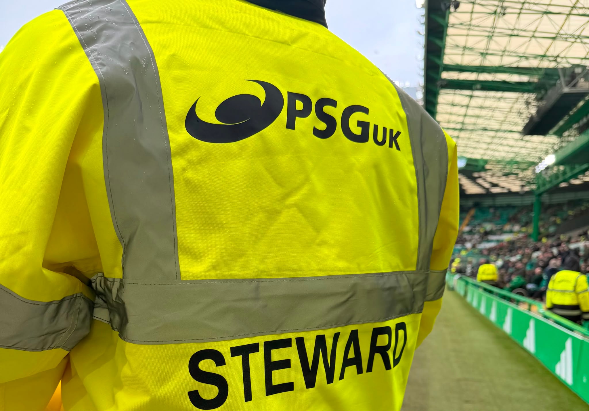 Festival crowd with PSG UK stewards visible